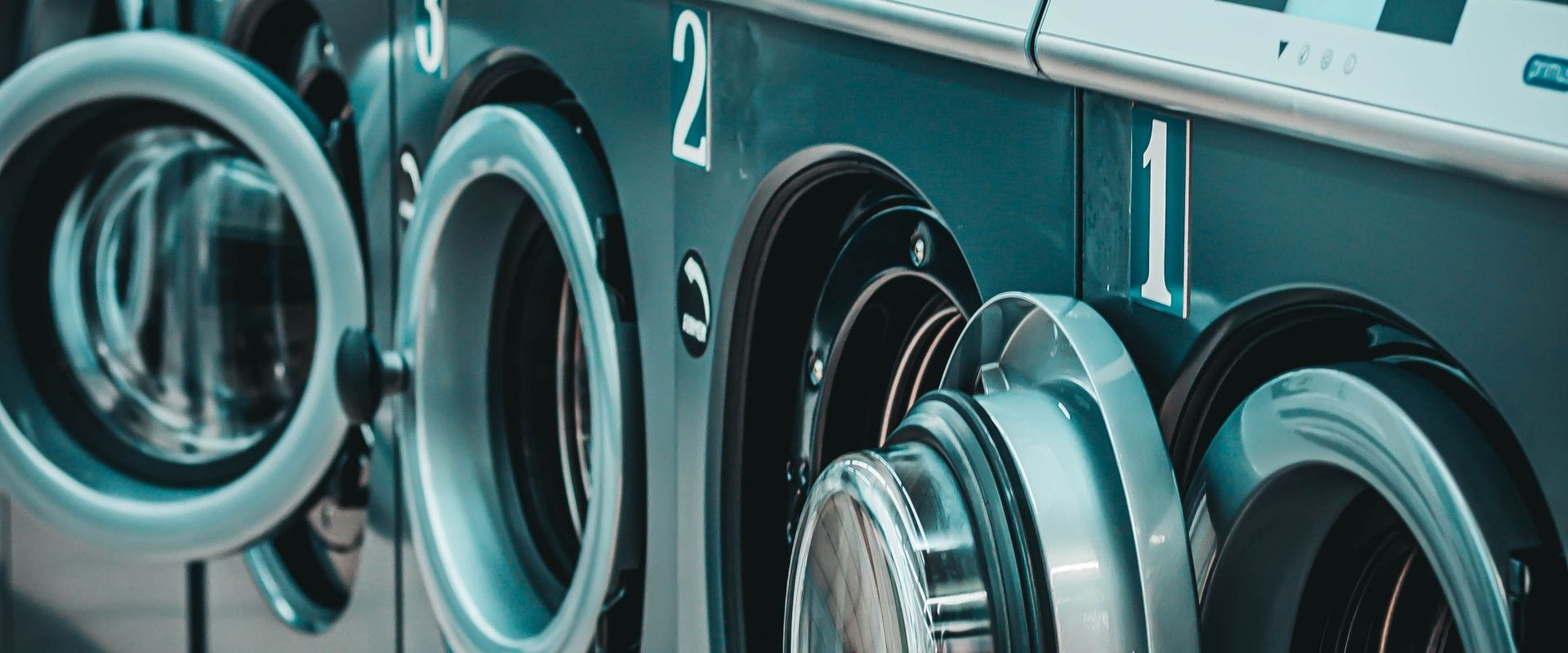 Row of modern front-load washing machines