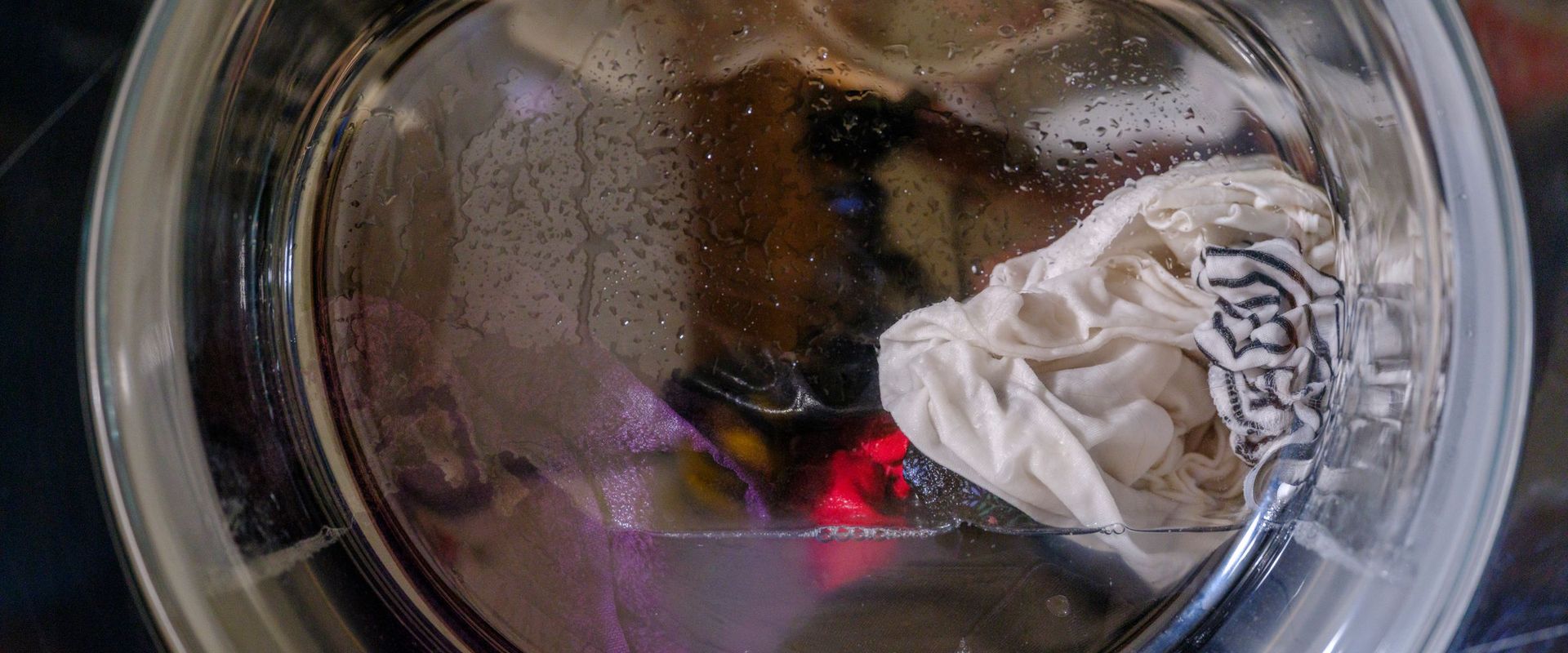 Wet clothes inside a front-load washing machine drum